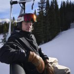
              FILE - Olympic snowboarder Taylor Gold, of the United States, rides a chair lift on Dec. 21, 2021, in Copper Mountain, Colo. (AP Photo/Brittany Peterson, File)
            