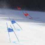 
              Gate flags bend in the wind after high winds caused a delay in the start of the mixed team parallel skiing event at the 2022 Winter Olympics, Saturday, Feb. 19, 2022, in the Yanqing district of Beijing. (AP Photo/Alessandro Trovati)
            