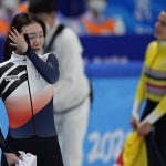 
              Choi Min-jeong of South Korea, reacts after her second place finish in the final of the women's 1000-meters during the short track speedskating competition at the 2022 Winter Olympics, Friday, Feb. 11, 2022, in Beijing. (AP Photo/David J. Phillip)
            