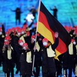 
              Francesco Friedrich and Claudia Pechstein, of Germany, lead their team in during the opening ceremony of the 2022 Winter Olympics, Friday, Feb. 4, 2022, in Beijing. (AP Photo/David J. Phillip)
            