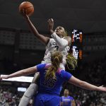 
              Connecticut's Aaliyah Edwards is fouled by DePaul's Kendall Holmes (35) as she goes up for a basket during the second half of an NCAA college basketball game Friday, Feb. 11, 2022, in Storrs, Conn. (AP Photo/Jessica Hill)
            