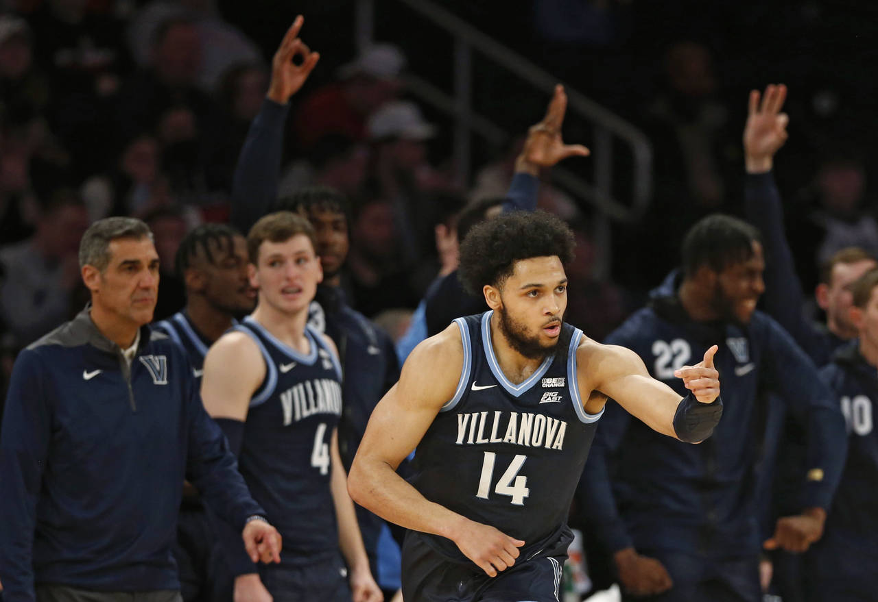 Villanova guard Caleb Daniels (14) reacts after making a three-point basket during the second half ...
