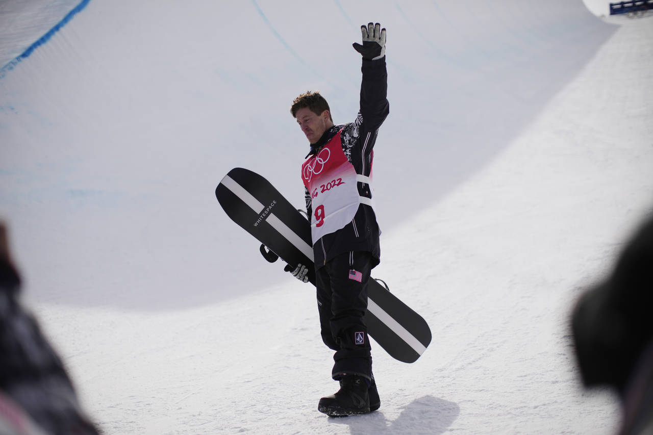 United States' Shaun White waves in the halfpipe course after the men's halfpipe finals at the 2022...