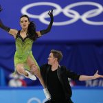 
              Madison Chock and Evan Bates, of the United States, perform their routine in the ice dance competition during figure skating at the 2022 Winter Olympics, Saturday, Feb. 12, 2022, in Beijing. (AP Photo/Bernat Armangue)
            