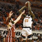 
              Oklahoma State forward Moussa Cisse (33) shoots over Oklahoma forward Tanner Groves (35) in the first half of an NCAA college basketball game Saturday, Feb. 5, 2022, in Stillwater, Okla. Oklahoma State defeated rival Oklahoma 64-55. (AP Photo/Brody Schmidt)
            