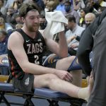 
              Gonzaga forward Drew Timme has his ankle taped during the second half of the team's NCAA college basketball game against Pepperdine, Wednesday, Feb.16, 2022, in Malibu, Calif. (AP Photo/John McCoy)
            