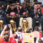 
              NBA Champions, from left, Ron Harper, Dennis Rodman, Scottie Pippen, Michael Jordan and coach Phil Jackson are joined on stage by Chicago Mayor Richard Daley, second from right, during a city-wide rally in Chicago to celebrate the Chicago Bulls 6th NBA championship on June 16, 1998. (AP Photo/Beth A. Keiser, File)
            