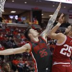 
              Indiana's Race Thompson, right, shoots over Ohio State's Kyle Young during the first half of an NCAA college basketball game Monday, Feb. 21, 2022, in Columbus, Ohio. (AP Photo/Jay LaPrete)
            