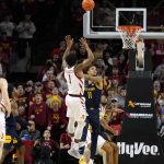 
              Iowa State guard Izaiah Brockington (1) shoots over West Virginia forward Jalen Bridges (11) after stealing the ball during the second half of an NCAA college basketball game, Wednesday, Feb. 23, 2022, in Ames, Iowa. Iowa State won 84-81. (AP Photo/Charlie Neibergall)
            