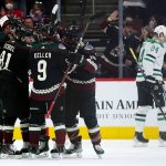 
              Arizona Coyotes center Nick Schmaltz (8) celebrates his goal against the Dallas Stars with Coyotes left wing Lawson Crouse, back left, Coyotes right wing Phil Kessel (81), Coyotes right wing Clayton Keller (9) and Coyotes defenseman Shayne Gostisbehere, second from right, as Stars center Roope Hintz (24) skates away during the second period of an NHL hockey game Sunday, Feb. 20, 2022, in Glendale, Ariz. (AP Photo/Ross D. Franklin)
            