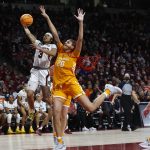 
              South Carolina's Destanni Henderson (3) shoots as Tennessee's Tamari Key (20) applies pressure during the second half of an NCAA college basketball game Sunday, Feb, 20, 2022, in Columbia, S.C. (Tracy Glantz/The State via AP)
            