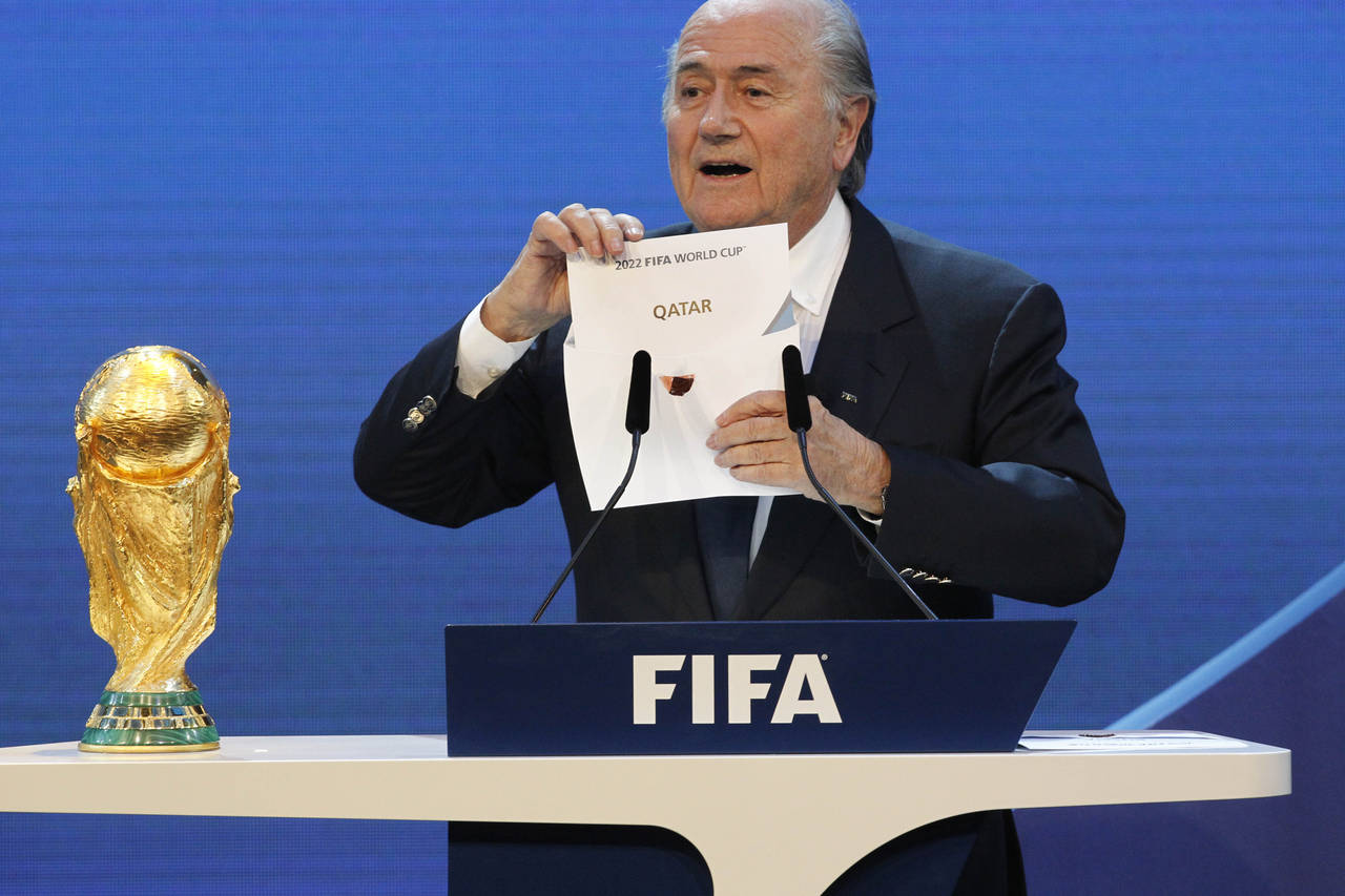 FILE - FIFA President Joseph Blatter announces Qatar as the host of the 2022 World Cup at a ceremon...