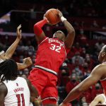 
              Ohio State forward E.J. Liddell (32) shoots over Rutgers forward Ron Harper Jr. (24) and center Clifford Omoruyi (11) during the half of an NCAA college basketball game in Piscataway, N.J., Wednesday, Feb. 9, 2022. (AP Photo/Noah K. Murray)
            