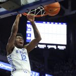 
              Kentucky's Keion Brooks Jr. (12) dunks during the first half of an NCAA college basketball game against Florida in Lexington, Ky., Saturday, Feb. 12, 2022. (AP Photo/James Crisp)
            