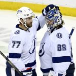 
              Tampa Bay Lightning defenseman Victor Hedman (77) and Tampa Bay Lightning goaltender Andrei Vasilevskiy (88) celebrate after the Lightning defeated the New Jersey Devils 6-3 in an NHL hockey game Tuesday, Feb. 15, 2022, in Newark, N.J. (AP Photo/Bill Kostroun)
            