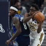 
              Indiana Pacers' Jalen Smith (25) grabs a rebound from Minnesota Timberwolves' Jarred Vanderbilt (8) during the second half of an NBA basketball game, Sunday, Feb. 13, 2022, in Indianapolis. (AP Photo/Darron Cummings)
            