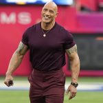 
              Dwayne "The Rock" Johnson smiles before the NFL Super Bowl 56 football game between the Los Angeles Rams and the Cincinnati Bengals, Sunday, Feb. 13, 2022, in Inglewood, Calif. (AP Photo/Chris O'Meara)
            