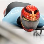 
              Yin Zheng of China takes a practice run during a men's skeleton training session at the 2022 Winter Olympics, Wednesday, Feb. 9, 2022, in the Yanqing district of Beijing. (AP Photo/Dmitri Lovetsky)
            