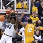 
              Missouri's Kobe Brown, left, dunks past Tennessee's Victor Bailey Jr., right, during the first half of an NCAA college basketball game Tuesday, Feb. 22, 2022, in Columbia, Mo. (AP Photo/L.G. Patterson)
            