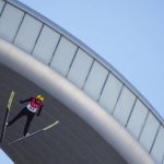 
              Karl Geiger, of Germany, soars through the air during the men's normal hill individual ski jumping qualification round at the 2022 Winter Olympics, Saturday, Feb. 5, 2022, in Zhangjiakou, China. (AP Photo/Matthias Schrader)
            