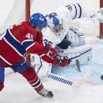 
              Montreal Canadiens' Laurent Dauphin, left, moves in against Toronto Maple Leafs goaltender Petr Mrazek during third-period NHL hockey game action in Montreal, Monday, Feb. 21, 2022. (Graham Hughes/The Canadian Press via AP)
            
