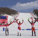 
              From left: Aleksander Aamodt Kilde, of Norway, silver, Johannes Strolz, of Austria, gold, and James Crawford, of Canada, bronze, celebrate during the medal ceremony for the the men's combined at the 2022 Winter Olympics, Thursday, Feb. 10, 2022, in the Yanqing district of Beijing. (AP Photo/Luca Bruno)
            