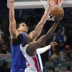 
              Detroit Pistons forward Jerami Grant (9) shoots against Dallas Mavericks center Dwight Powell during the first half of an NBA basketball game in Dallas, Tuesday, Feb. 8, 2022. (AP Photo/LM Otero)
            