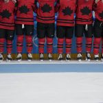 
              Canada poses for photos after defeating the United States in the women's gold medal hockey game at the 2022 Winter Olympics, Thursday, Feb. 17, 2022, in Beijing. (AP Photo/Petr David Josek)
            