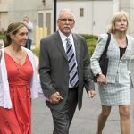 
              FILE - Former UCLA gynecologist Dr. James Heaps, center, with his wife Deborah, left, and defense attorney Tracy Green leave Los Angeles Superior Court, on June 26, 2019. A lawsuit alleging that the former UCLA gynecologist sexually abused hundreds of women has been settled for $246.3 million. The amount of the settlement was announced Tuesday, Feb. 8, 2022, by UCLA and some of the lawyers representing 203 women. It's one of hundreds of lawsuits filed by patients who allege that Dr. Heaps groped or otherwise abused them during his 35-year career. (AP Photo/Damian Dovarganes, File)
            