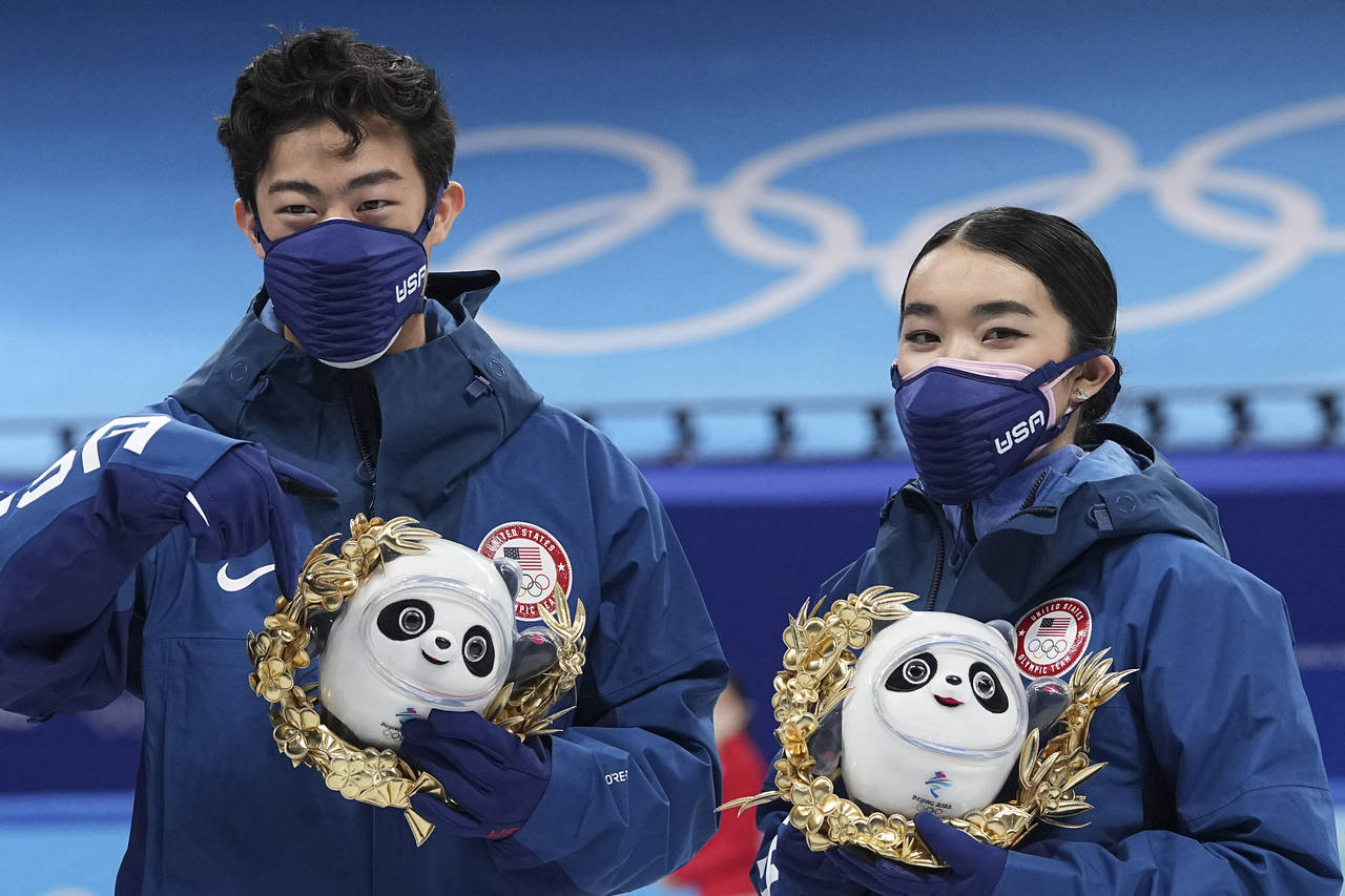 Silver medalists Karen Chen and Nathan Chen pose for a photo after the team event in the figure ska...