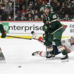 
              Florida Panthers left wing Mason Marchment (17) falls near Minnesota Wild left wing Marcus Foligno (17) and defenseman Jared Spurgeon (46) during the second period of an NHL hockey game Friday, Feb. 18, 2022, in St. Paul, Minn. (AP Photo/Andy Clayton-King)
            
