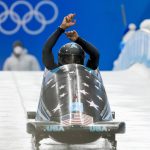 
              Elana Meyers Taylor, of the United States, drives during the women's monobob heat 3 at the 2022 Winter Olympics, Monday, Feb. 14, 2022, in the Yanqing district of Beijing. (AP Photo/Mark Schiefelbein)
            