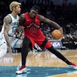 
              Charlotte Hornets guard Kelly Oubre Jr. (12) guards Toronto Raptors forward Pascal Siakam (43) during the second half of an NBA basketball game in Charlotte, N.C., Monday, Feb. 7, 2022. (AP Photo/Jacob Kupferman)
            