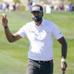 
              Sahith Theegala acknowledges the gallery on the ninth hole after making a birdie during the third round of the Phoenix Open golf tournament Saturday, Feb. 12, 2022, in Scottsdale, Ariz. (AP Photo/Darryl Webb)
            
