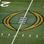 
              FILE - The College Football Playoff logo is shown on the field at AT&T Stadium before an NCAA college football game in Arlington, Texas, Jan. 1, 2021. The College Football Playoff is set to remain a four-team format through the 2025 season after the administrators who manage the postseason failed to agree on an expansion plan before the current contracts run out. A person involved with the decision told The Associated Press on Friday, Feb. 18, 2022, that the CFP management committee, comprised of 10 conference commissioners and Notre Dame’s athletic director, met by video conference earlier this week. (AP Photo/Roger Steinman, File)
            