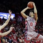 
              Rutgers guard Geo Baker (0) shoots over Wisconsin forward Tyler Wahl during the second half of an NCAA college basketball game Saturday, Feb. 26, 2022, in Piscataway, N.J. (AP Photo/Adam Hunger)
            