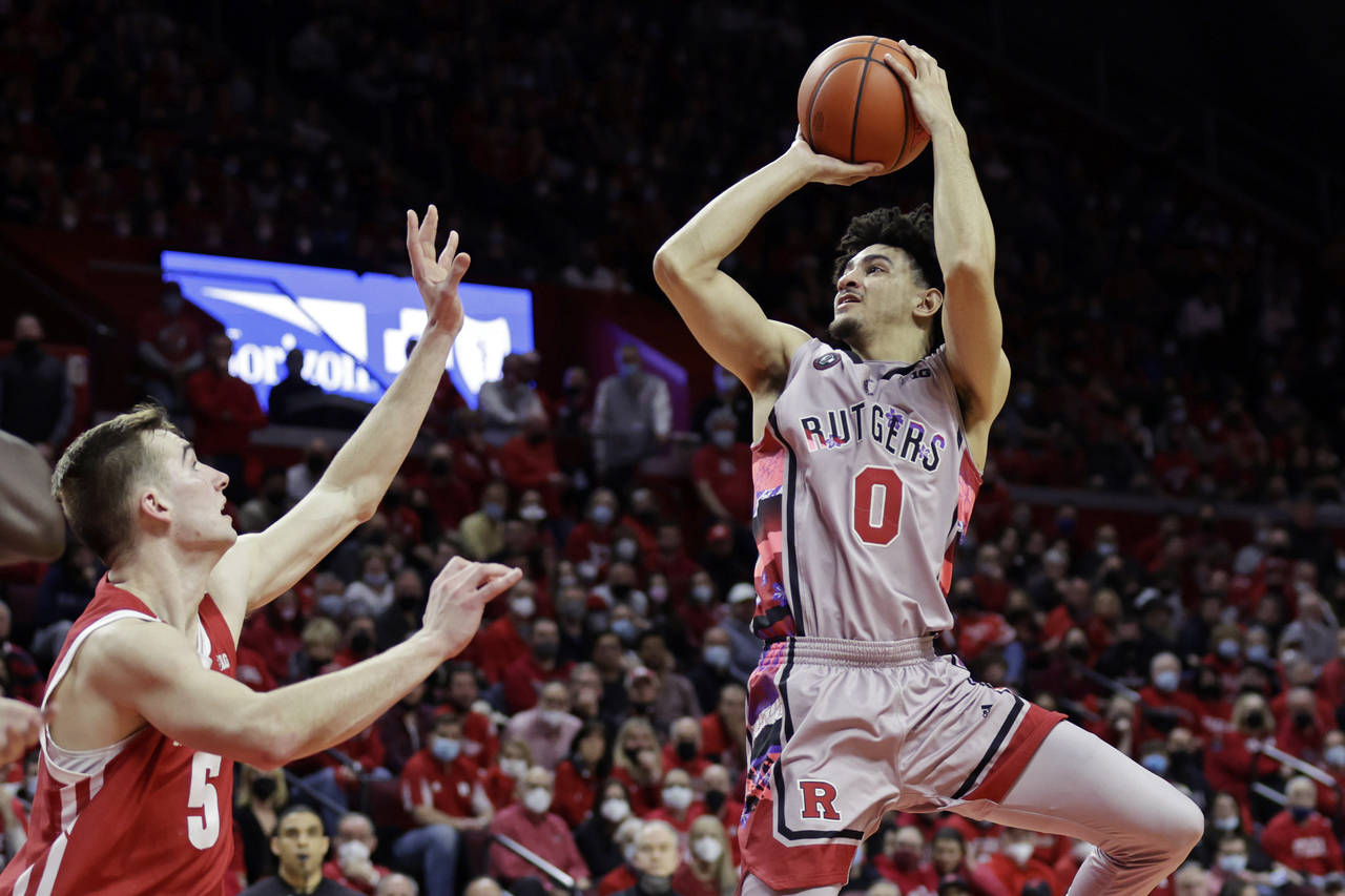 Rutgers guard Geo Baker (0) shoots over Wisconsin forward Tyler Wahl during the second half of an N...