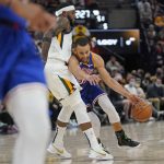 
              Utah Jazz forward Royce O'Neale defends against Golden State Warriors guard Stephen Curry, right, during the first half during an NBA basketball game Wednesday, Feb. 9, 2022, in Salt Lake City. (AP Photo/Rick Bowmer)
            