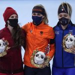 
              Gold medal winner Irene Schouten of the Netherlands, center, poses with silver medalist Ivanie Blondin of Canada, left, and bronze medalist Francesca Lollobrigida of Italy, right, during a venue ceremony for the women's speedskating mass start finals at the 2022 Winter Olympics, Saturday, Feb. 19, 2022, in Beijing. (AP Photo/Sue Ogrocki)
            