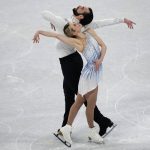 
              Ashley Cain-Gribble and Timothy Leduc, of the United States,compete in the pairs short program during the figure skating competition at the 2022 Winter Olympics, Friday, Feb. 18, 2022, in Beijing. (AP Photo/David J. Phillip)
            