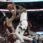 
              North Carolina State guard Terquavion Smith (0) drives to the basket while Boston College guard Makai Ashton-Langford (11) defends during the second half of an NCAA college basketball game in Raleigh, N.C., Wednesday, Feb. 23, 2022. (AP Photo/Gerry Broome)
            