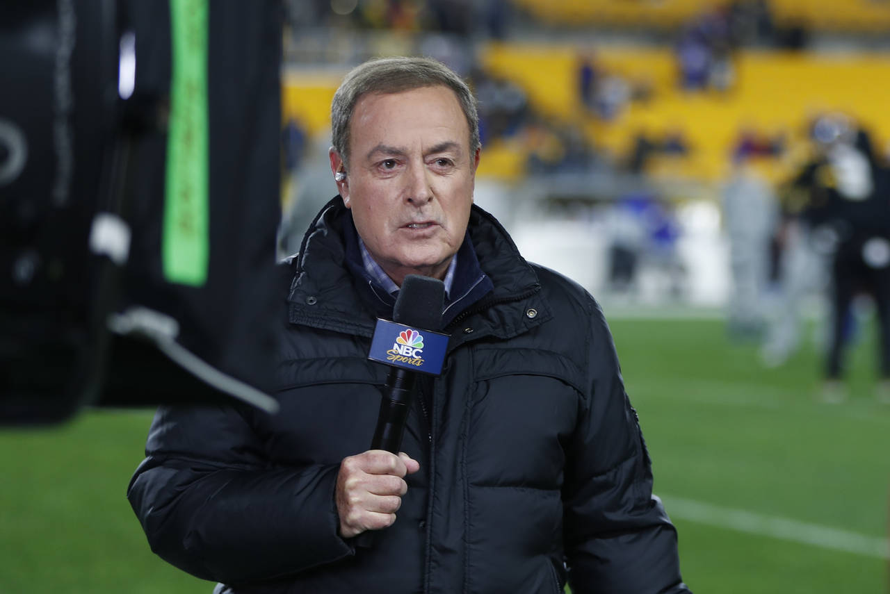 FILE - NBC Sports commentator Al Michaels reports from the sidelines before an NFL football game be...