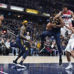 
              Indiana Pacers' Tristan Thompson (11) grabs a rebound against Washington Wizards' Isaiah Todd (14) during the first half of an NBA basketball game, Wednesday, Feb. 16, 2022, in Indianapolis. (AP Photo/Darron Cummings)
            