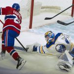 
              Buffalo Sabres goalie Craig Anderson stops a shot from Montreal Canadiens right wing Cole Caufield (22) during the first period of an NHL hockey game Wednesday, Feb. 23, 2022, in Montreal. (Peter McCabe/The Canadian Press via AP)
            