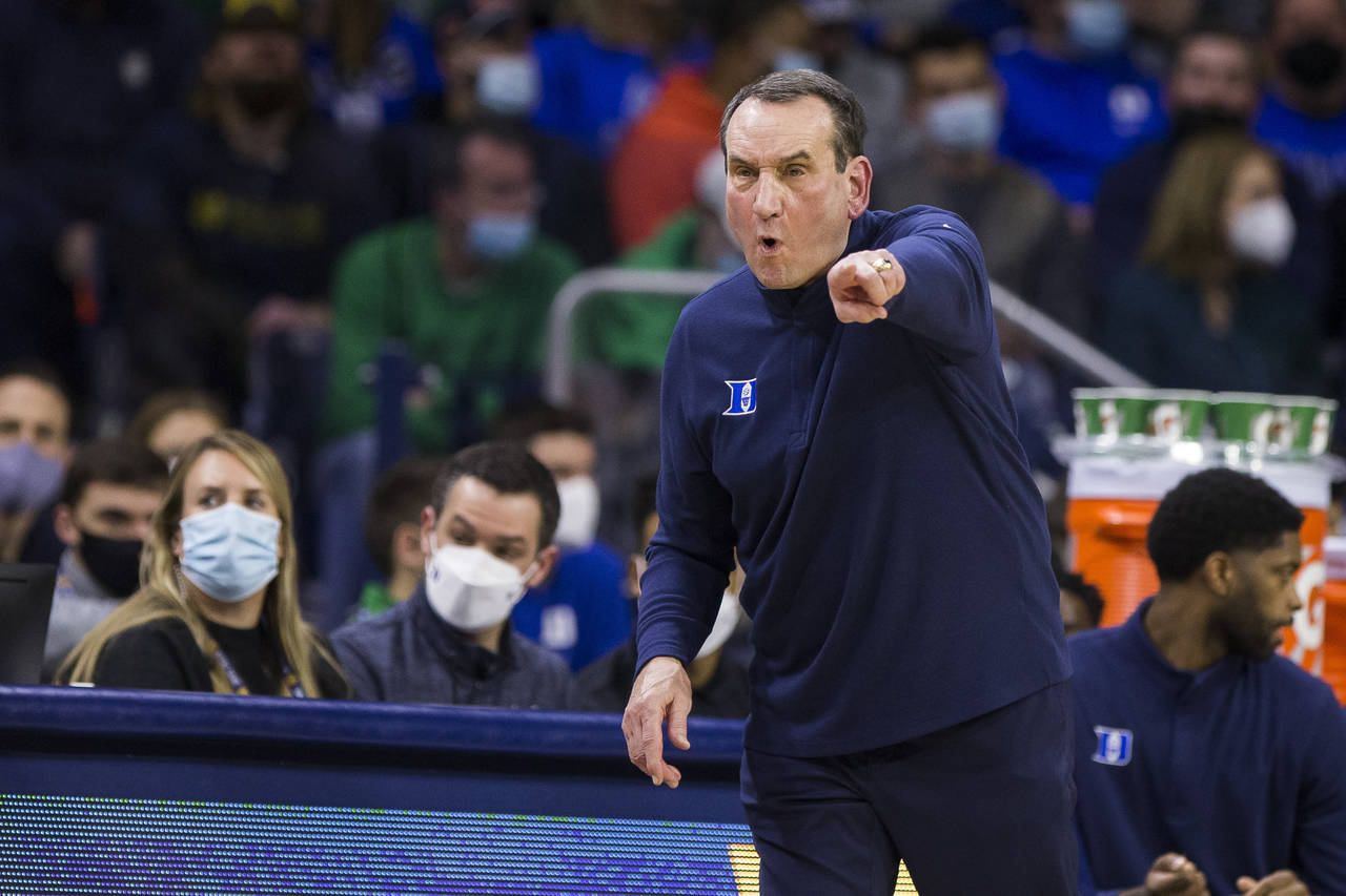 Duke head coach Mike Krzyzewski directs his players during the second half of an NCAA college baske...