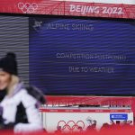 
              The board in the finish area shows that the men's downhill was postponed due to weather at the 2022 Winter Olympics, Sunday, Feb. 6, 2022, in the Yanqing district of Beijing. (AP Photo/Robert F. Bukaty)
            