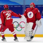 
              Russian Olympic Committee's Polina Bolgareva (21) is congratulated by goalkeeper Maria Sorokina (69) after scoring a goal against Switzerland during a preliminary round women's hockey game at the 2022 Winter Olympics, Friday, Feb. 4, 2022, in Beijing. (AP Photo/Matt Slocum)
            