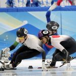 
              John-Henry Krueger, left, of Hungary leads Kazuki Yoshinaga of Japan and Denis Airapetian of the Russian Olympic Committee as they collide during their heat of the men's 1,000-meter the short track speedskating competition at the 2022 Winter Olympics, Saturday, Feb. 5, 2022, in Beijing. (AP Photo/David J. Phillip)
            