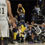 
              Memphis Grizzlies guard Ja Morant (12) goes up for a shot at the buzzer at the end of the first half of the team's NBA basketball game against the San Antonio Spurs on Monday, Feb. 28, 2022, in Memphis, Tenn. (AP Photo/Brandon Dill)
            
