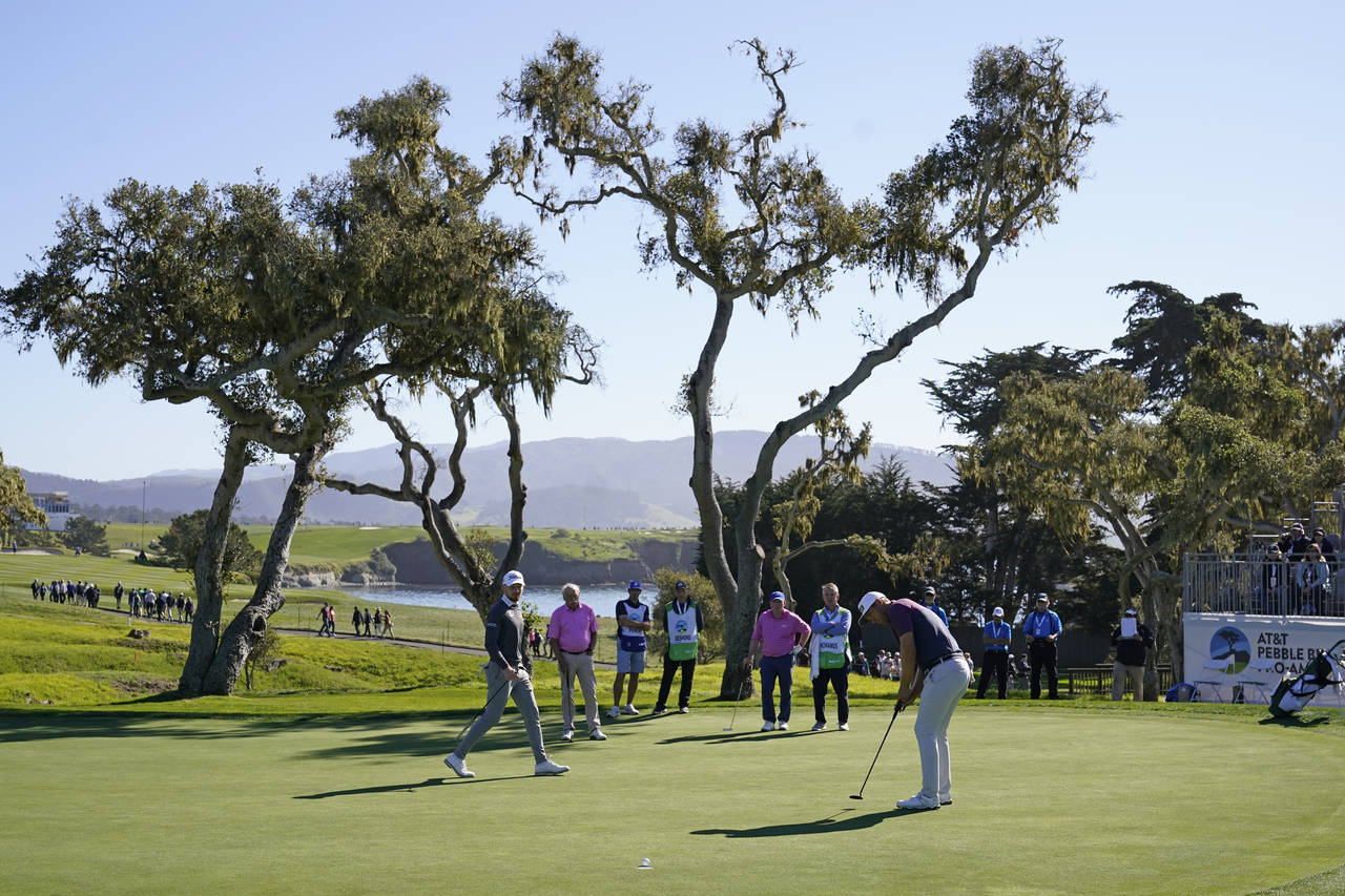 Seamus Power, of Ireland, makes a birdie putt on the 16th green of the Pebble Beach Golf Links duri...